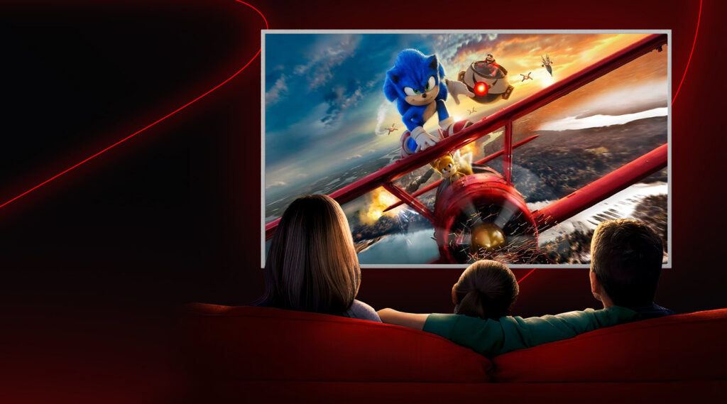 a family looking at a tv screen