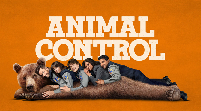 people laying on a bear behind them orange background