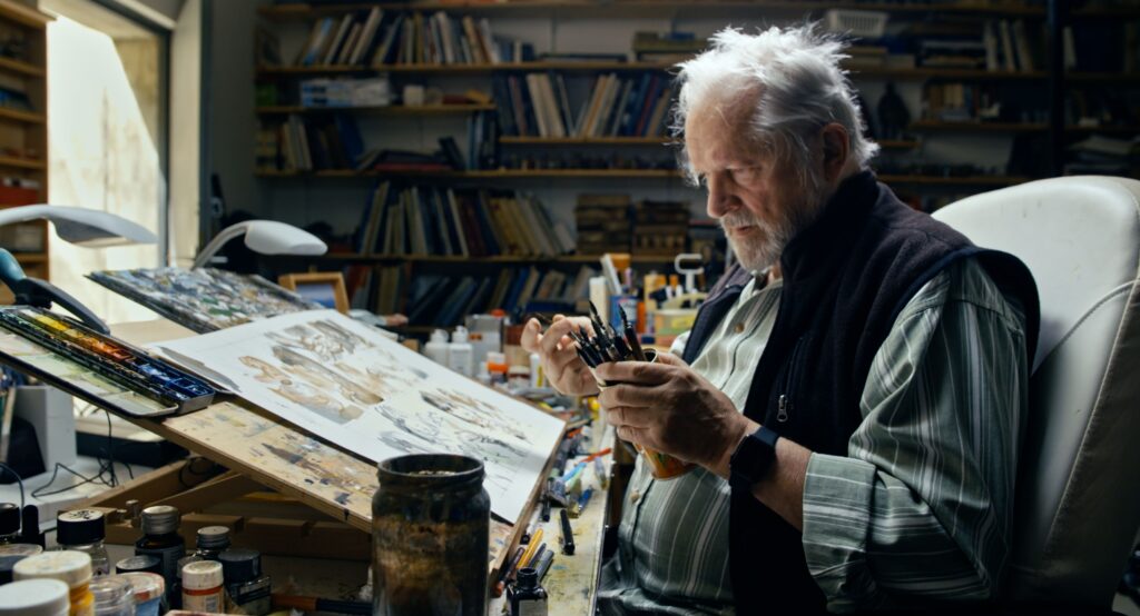 vana mees istub ja joonistab
