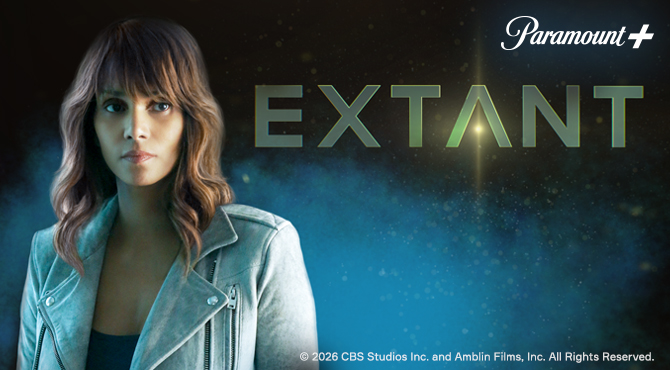 a woman looking to the side behind her a blue background