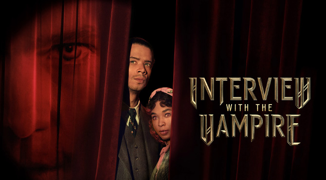 a man and a woman in between the dark curtains